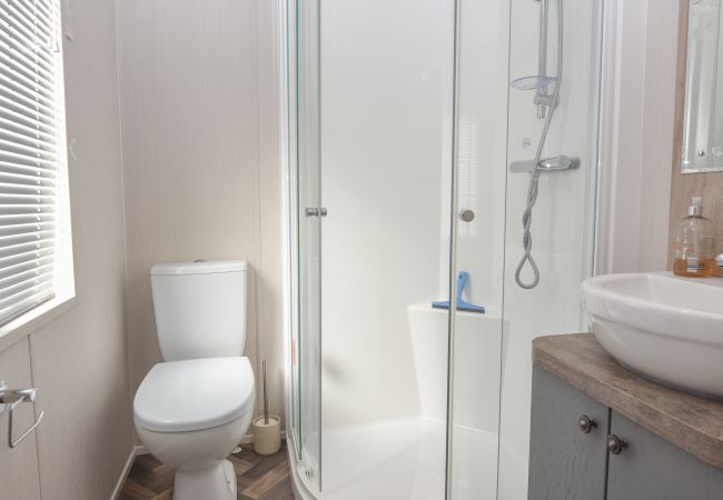  Holiday Lodge En-suite shower room with basin and WC.