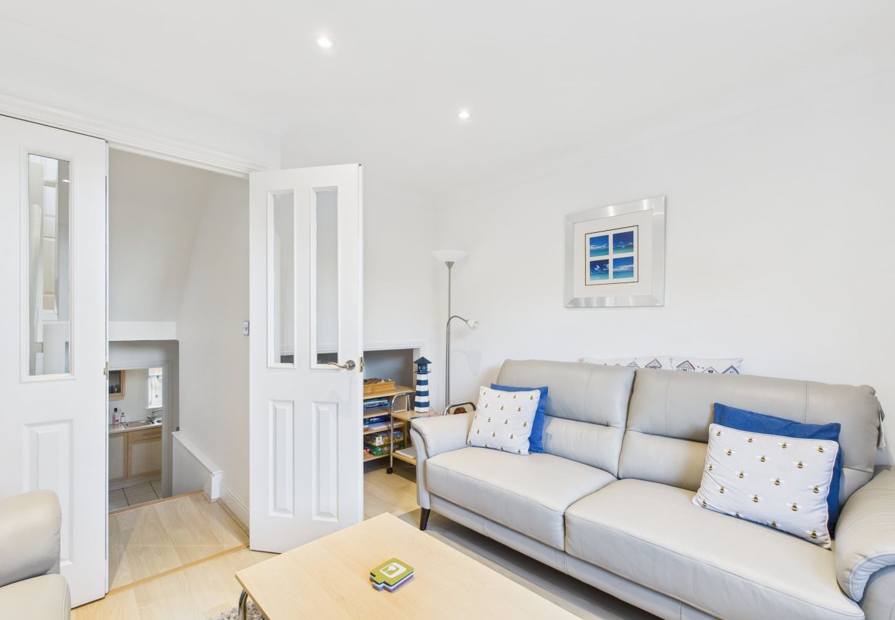 A second view of the lounge, highlighting the games and the spacious, light-filled family area.