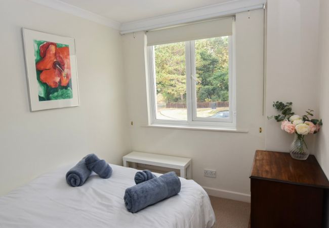 The Cottage Holiday home double bedroom with table and chest of drawers.