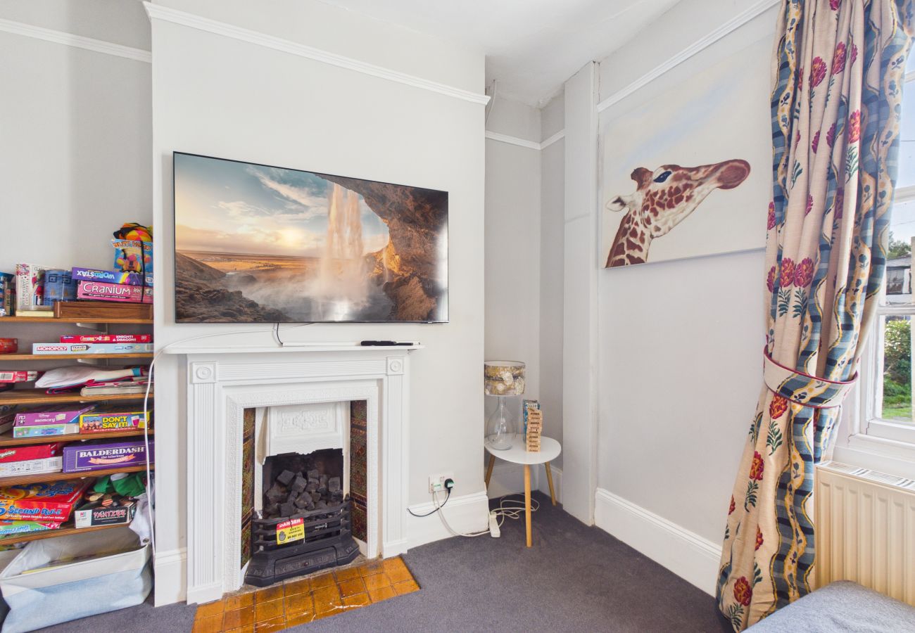 View of the lounge showing the wall-mounted TV and comfortable seating area.