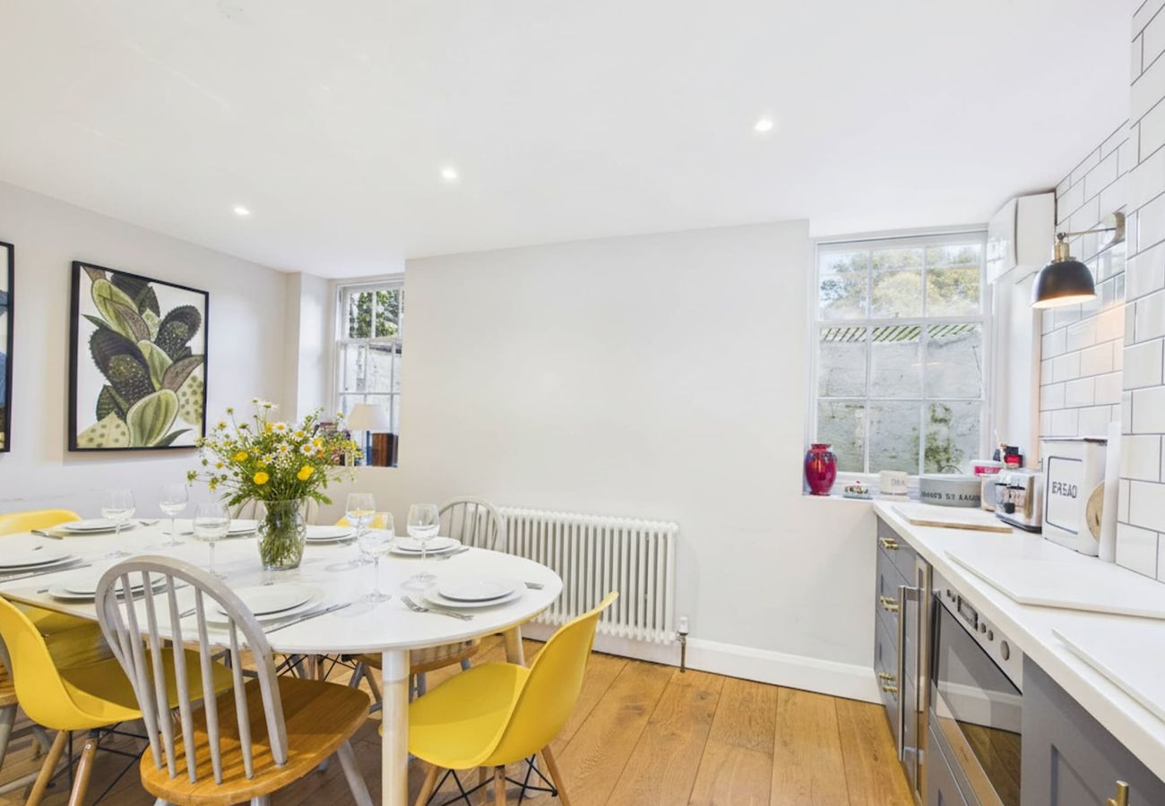 Large kitchen dining room with wine cooler and microwave.