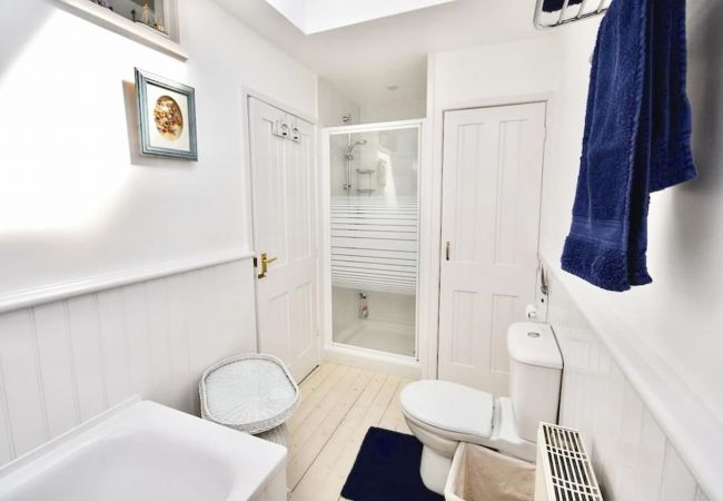 Mulberry Cottage Holiday Home Family Bathroom: Bath, separate shower, basin and WC, washing machine and tumble dryer.