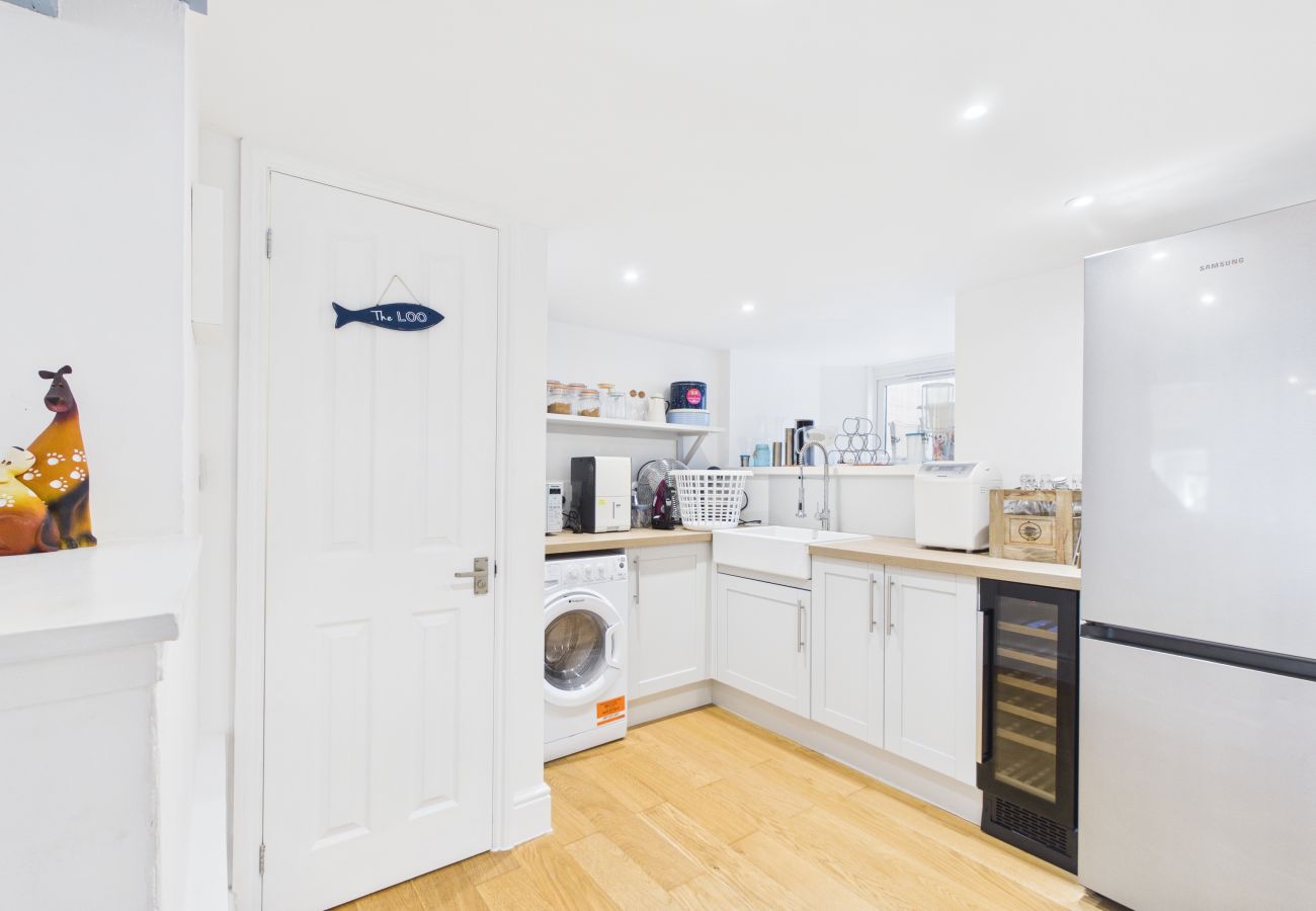 Amenities Utility room with washer and fridge at Granville Coast holiday home Cowes