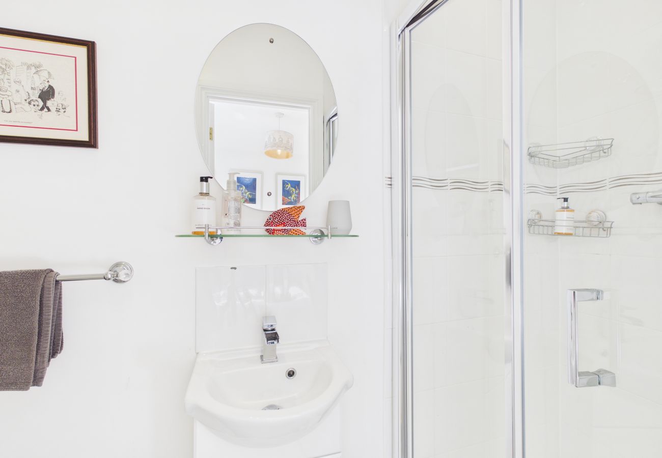 Ground floor en‑suite shower room at Granville Coast holiday home