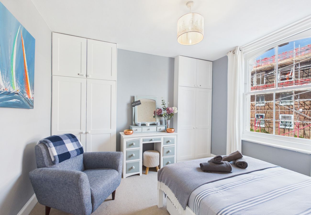Master bedroom with dressing table at Granville Coast holiday home