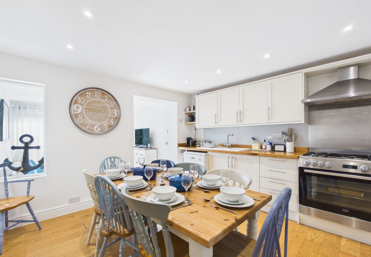 Open‑plan kitchen and dining area at Granville Coast holiday home